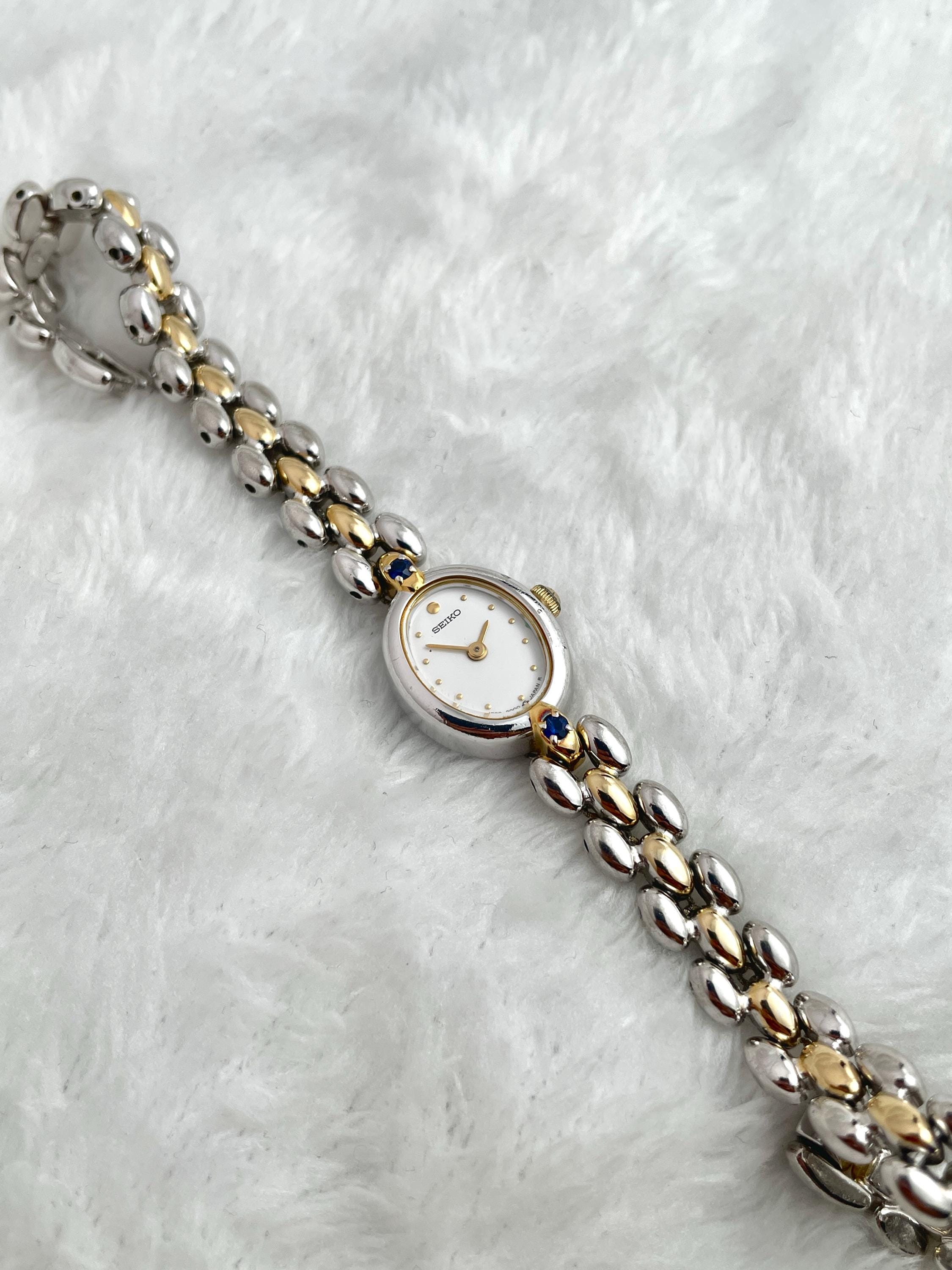 Seiko Ruby Petite Two-tone Blue Gemstone Ladies Watch 1E20-6140